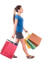 Back view of going woman with shopping bags . beautiful girl i Royalty Free Stock Photo