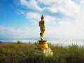 Back view of golden great buddha statue on the top of mountain Royalty Free Stock Photo