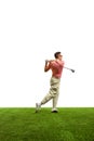 Back view. Golfer hit sweeping driver after hitting golf ball down fairway at golf club. Hobby in holiday and vacation Royalty Free Stock Photo