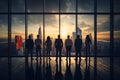 Back view a group of businessman and businesswoman standing in office looking out window, business aspirations and vision concept Royalty Free Stock Photo