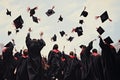 Back view of a group of graduates throwing mortarboards in the air, A group of graduates throwing graduation caps in the air, no Royalty Free Stock Photo