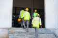 back view of group of Industrial workers coming to work at factory - concept of daily wagers, employement and blue