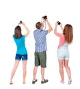 Back view group of people photographed attractions. Royalty Free Stock Photo