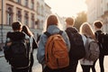 Back view of a group of students walking on the street. Backpackers with backpacks, School students full rear view with school