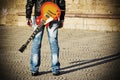 Back view of a guitarist standing with a guitar Royalty Free Stock Photo
