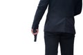 back view of gun man wearing black suit holding pistol on white background Concept for assassin, murder, criminal, bandit Royalty Free Stock Photo