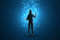 Back view of hacker using abstract glowing binary code hologram on background. Programming, hacking and theft concept Royalty Free Stock Photo