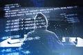 Back view of hacker using computers at desk with creative digital programming language on blurry background. Software developer, Royalty Free Stock Photo