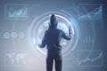 Back view of hacker using digital business interface on gray background. Hacking and dashboard concept. Royalty Free Stock Photo