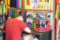 The back view of a hand crafter doing decorative knots work