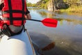 Back view of a hand with red paddle rafting on the river Royalty Free Stock Photo