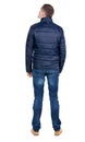 Back view of handsome man in blue windcheater looking. Royalty Free Stock Photo