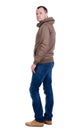 Back view of handsome man in brown windcheater looking up. Royalty Free Stock Photo