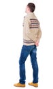 Back view of handsome man in warm sweater looking up. Royalty Free Stock Photo