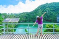 Back view of happiness woman at the famous saltwater Emerald at Thale Nai on Koh Mae Ko island viewpoint at beautiful nature Royalty Free Stock Photo