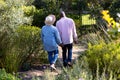 Back view of happy african american senior couple holding hands outdoors Royalty Free Stock Photo