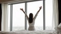 Happy young woman wake up stretching in morning Royalty Free Stock Photo