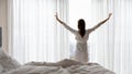 Happy young woman stretch in bed welcoming new day Royalty Free Stock Photo