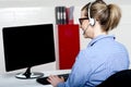 Back view of help desk lady working Royalty Free Stock Photo