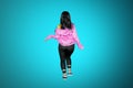 Back view of hip-hop dancer posing in studio Royalty Free Stock Photo