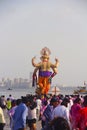 Back view of huge standing Ganapati idol with crowd, Ganapati visarjan, Girgaon Chowpatty