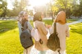 Back view image of happy friends muslim sisters women walking outdoor