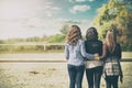 young three ladies standing over beauty nature background