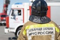 Back view of inscription Emercom of Russia on uniform firefighter of Ministry of Civil Defence, Emergencies and Disaster Royalty Free Stock Photo