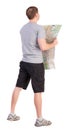 Back view of journey young man looking at the map Royalty Free Stock Photo