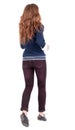 Back view of jumping woman in jeans. Royalty Free Stock Photo