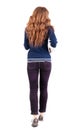 Back view of jumping woman in jeans. Royalty Free Stock Photo