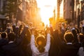 Back view large group of business people celebrating in the street in sunset light. Concept of victory, successful business and Royalty Free Stock Photo