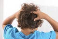 Back view of little boy Itchy Scalp from Head Lice Royalty Free Stock Photo