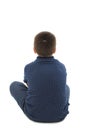 Back view of little boy sitting on floor looking at wall. Rear view Royalty Free Stock Photo