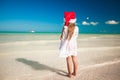 Back view of Little cute girl in red hat santa Royalty Free Stock Photo