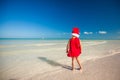 Back view of Little cute girl in red hat santa Royalty Free Stock Photo