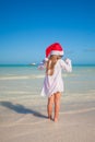 Back view of Little cute girl in red hat santa Royalty Free Stock Photo