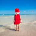 Back view of Little cute girl in red hat santa Royalty Free Stock Photo