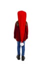 Back view of little girl in red Santa hat looking at wall. Rear view. Royalty Free Stock Photo