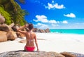 Back view of long haired woman in bikini on tropical beach Royalty Free Stock Photo