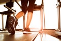 Back view of lower body legs of fitness girl running on machine Royalty Free Stock Photo