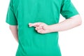 Back view of male doctor holding fingers crossed