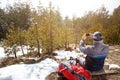 Back view of hikers taking photo of nature