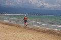 Back view of male walking in beach of Manfredonia