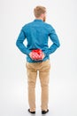 Back view of man with beard holding red gift Royalty Free Stock Photo