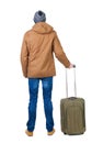 Back view of man in a brown jacket with suitcase .