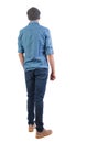 Back view of man in dark jeans. Standing young guy. Rear view people collection. backside view of person. Isolated over white