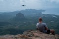 Back view of man drone operator on the mountain view point Royalty Free Stock Photo
