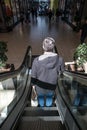 Back view of man on escalator