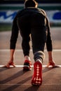 Man feet in starting position for running on race track in stadium Royalty Free Stock Photo